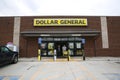 Customers exiting Dollar General with carts full of items