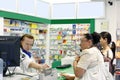 Customers inside a pharmacy shop Royalty Free Stock Photo