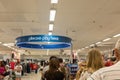 Customers line up at a central pay point in K-Mart