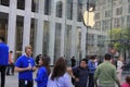 Customers line up outside of the Apple Store on Fifth Avenue to buy the new iPhone 6