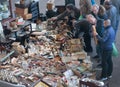 Customers look for bargains at flea market stand