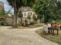 Customers lounging at the garden cafe tables at Montmartre Museum