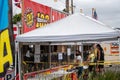 Customers with masks line up to buy fireworks from stands in Fillmore ahead of the Fourth of July Celebrations