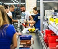 Customers paying for shopping at a supermarket. Line at the cash