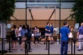 Customers queue outside Apple store in Orchard Road, waiting for their turn to go in; safe entry, social distancing measures