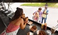 Customers queue and saleswoman at food truck