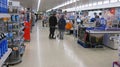 Customers queueing at the checkouts in a supermarket or superstore.