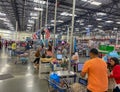 Customers scanning thier items at the self check out stations at a Sams Club in Orlando, Florida