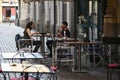 Customers seated at bar terrace tables