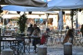 Customers seated at bar terrace tables