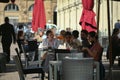 Customers seated at bar terrace tables