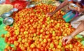 Tomato sale. woman and man picking fresh vegetables on the market. Male and female hands. Royalty Free Stock Photo