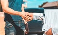 Customers shake hand with car insurance agents to enter into friendly terms and conditions Royalty Free Stock Photo