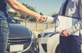 Customers shake hand with car insurance agents to enter into friendly terms and conditions Royalty Free Stock Photo