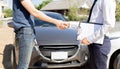 Customers shake hand with car insurance agents to enter into friendly terms and conditions Royalty Free Stock Photo