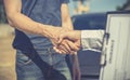 Customers shake hand with car insurance agents to enter into friendly terms and conditions Royalty Free Stock Photo