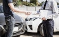 Customers shake hand with car insurance agents to enter into friendly terms and conditions Royalty Free Stock Photo