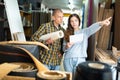 Customers shopping in building store and pointing to something Royalty Free Stock Photo