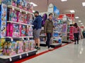 Customers shopping in the kids toy and game department inside a Target store