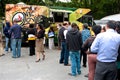 Customers Stand In Long Line To Order From Food Trucks