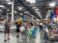 Customers standing in long lines waiting to check out their groceries at a Sams Club in Orlando, Florida due to the hoarding of