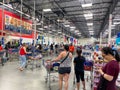 Customers standing in long lines waiting to check out their groceries at a Sams Club in Orlando, Florida