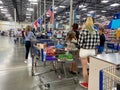 Customers standing in long lines waiting to check out their groceries at a Sams Club in Orlando, Florida