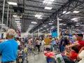 Customers standing in long lines waiting to check out their groceries at a Sams Club in Orlando, Florida