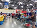 Customers standing in long lines waiting to check out their groceries at a Sams Club in Orlando, Florida Royalty Free Stock Photo