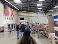 Customers standing in long lines waiting to get out of a Sams Club in Orlando, Florida due to the hoarding of food and supplies