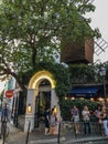 Customers wait outside Moulin de la Galette on Montmartre in Paris