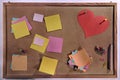 Customizable blank post-its and red heart shape on cork message board