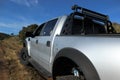 A customized Ford F-150 Raptor SVT on a dirt road