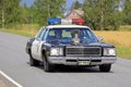 Customized Plymouth Police Car on the Road