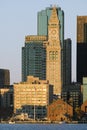 The Customs House Clock Tower and Boston skyline at sunrise, as seen from South Boston, Massachusetts, New England Royalty Free Stock Photo