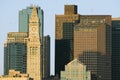 The Customs House Clock Tower and Boston skyline at sunrise, as seen from South Boston, Massachusetts, New England Royalty Free Stock Photo