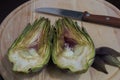 Cut artichoke on the table Royalty Free Stock Photo