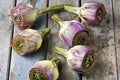 Cut Artichokes on Rustic Table Royalty Free Stock Photo