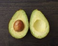 Cut Avocado halves with seed Royalty Free Stock Photo
