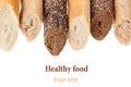 Cut baguette bread of different varieties on a white background. Royalty Free Stock Photo