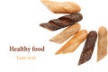 Cut baguette bread of different varieties on a white background. Royalty Free Stock Photo