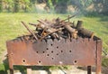 Cut branches in a chargrill outdoors