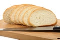The cut bread on a chopping board with a knife Royalty Free Stock Photo