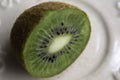 Kiwi half cut lies on a platter