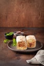 A cut Chicken doner kebab in roll of pita bread lavash. Shawarma Sandwich on a wooden background Royalty Free Stock Photo