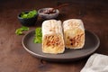 A cut Chicken doner kebab in roll of pita bread lavash. Shawarma Sandwich on a wooden background Royalty Free Stock Photo