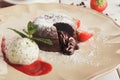 Chocolate fondant with vanilla ice cream and strawberry Royalty Free Stock Photo