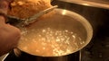 Cut the dough with scissors and cook the gnocchi in boiling water