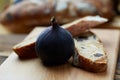 Cut figs on a wooden Board watered with honey. Rustic style