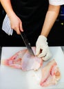 Cut fish fillet in a fish shop, chef cutting fish in the kitchen Royalty Free Stock Photo